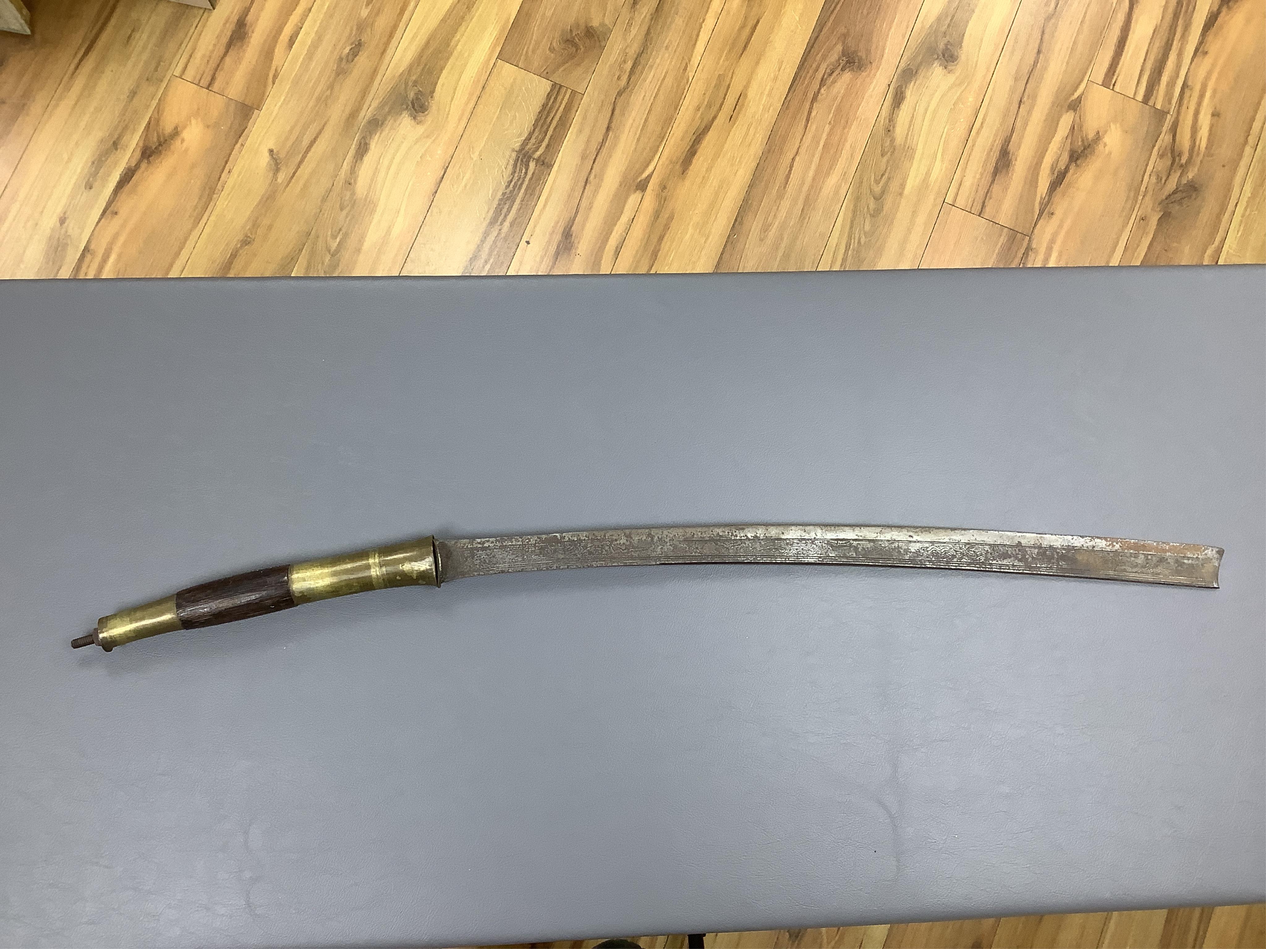 Eighteen assorted world weapons comprising a silver jambya (pommel missing), a knobkerry, a dha, two kris (one with handle missing), a lohar, three kukris, a djambok, a Chinese trousse, a chora, a flyssa, five others and